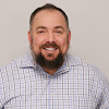 team member headshot of Justin Burkholder